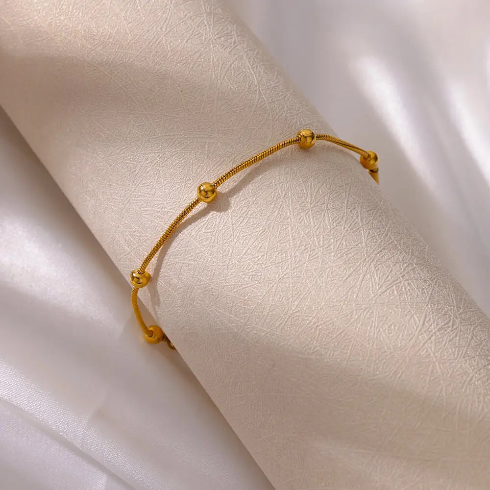 Bracelet Or avec Boules Dorées acier