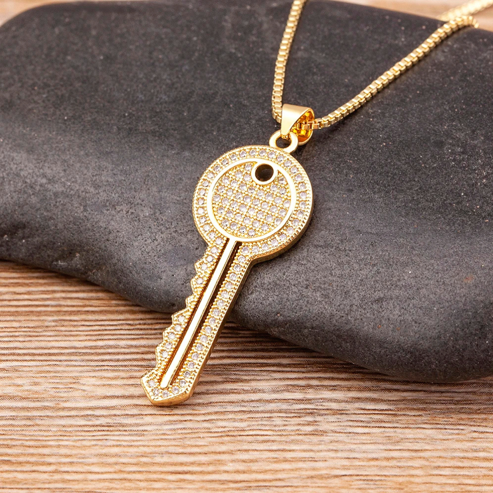 Collier Clé Doré diamant