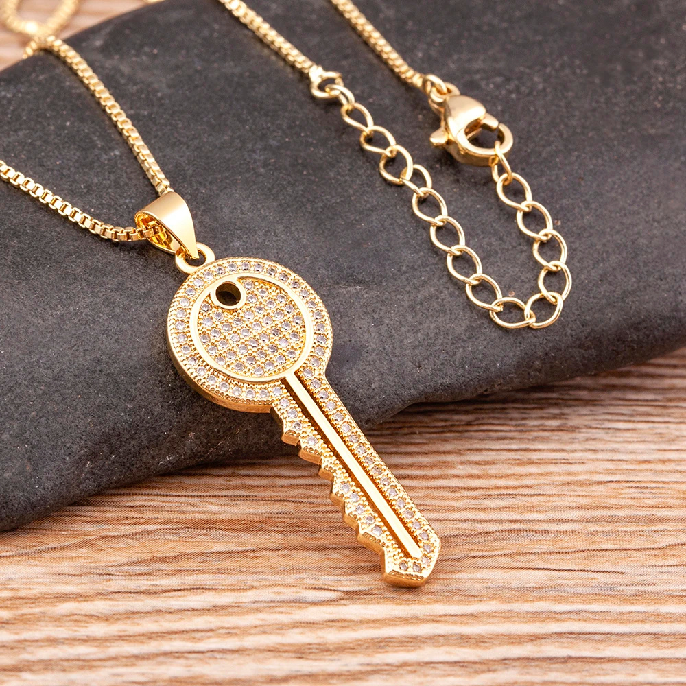 Collier Clé Doré femme