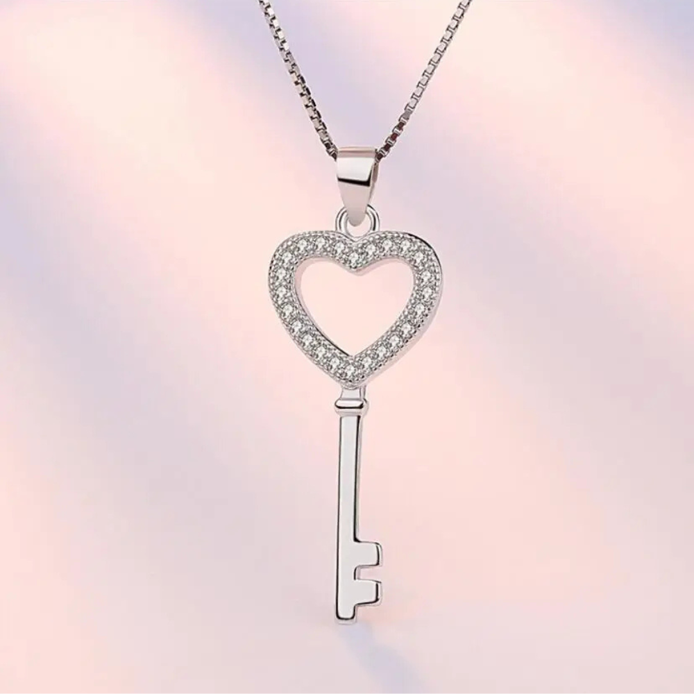 Collier Clé acier Femme