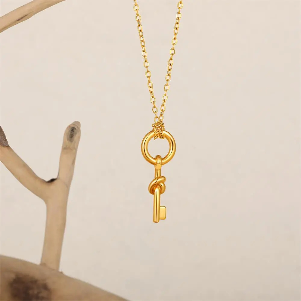Collier Clé Nœud doré