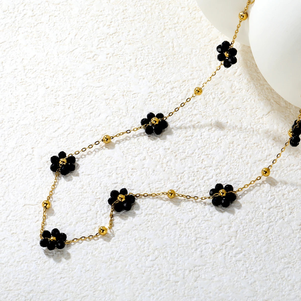 Collier Fleur Noira acier doré