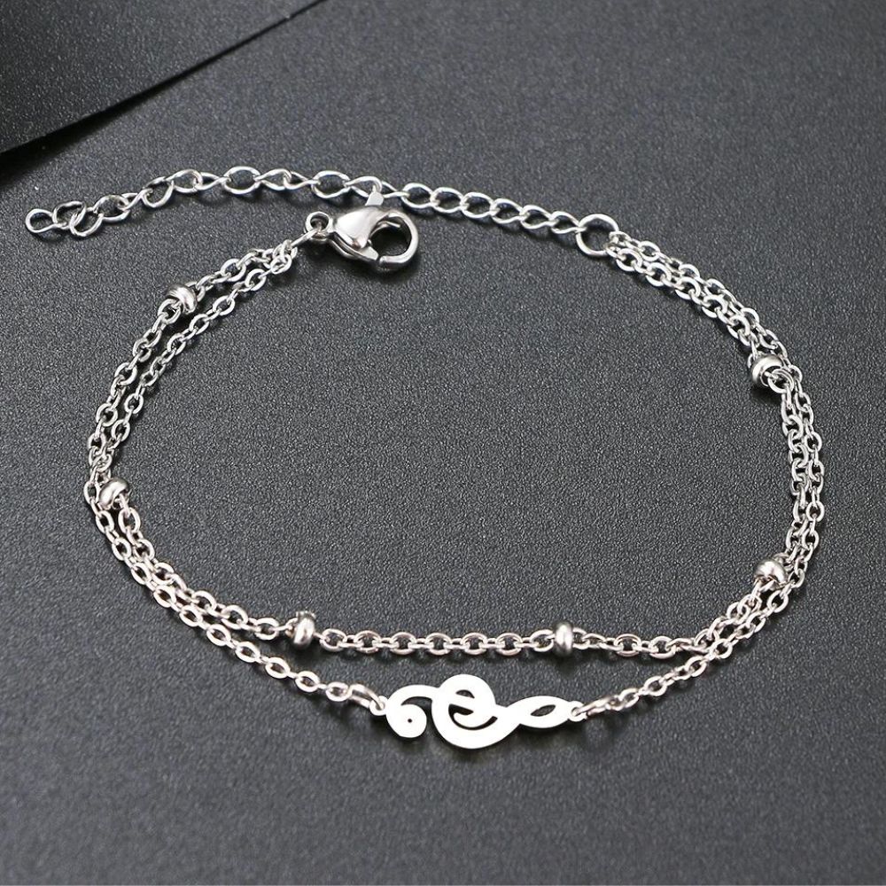 bracelet cle de sol de couleur argent